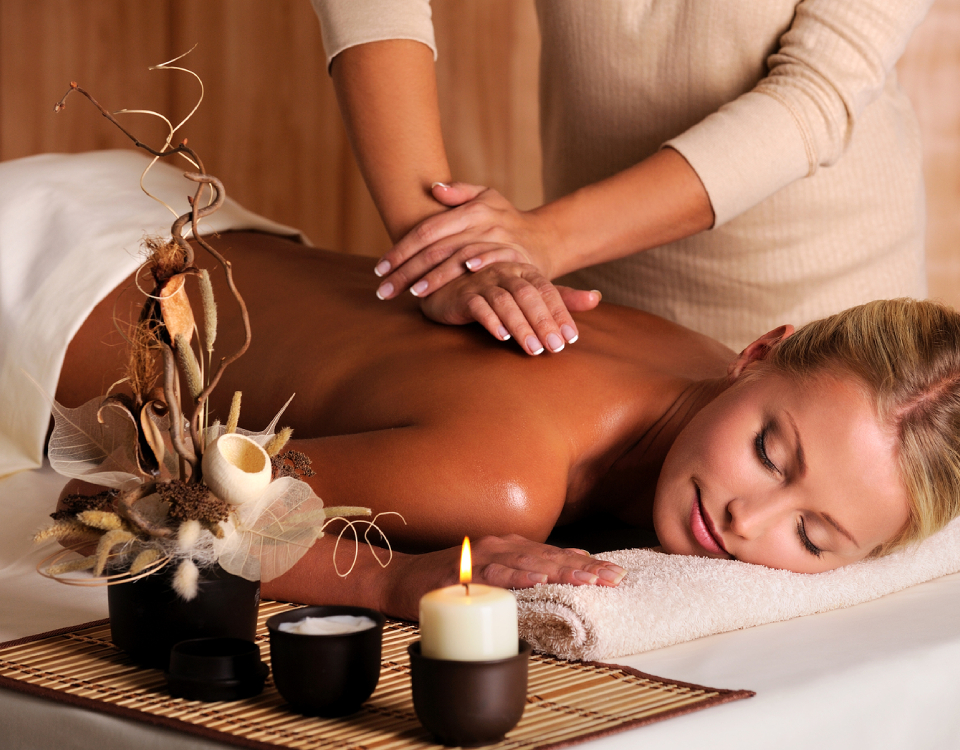 Woman Experiencing A Massage Therapy In A Well Known Massage Centre By A Professional Massage Therapist.